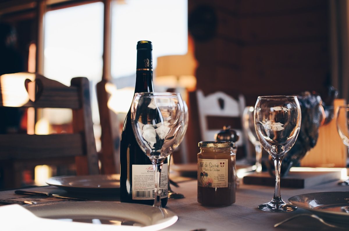 Guests toasting with glasses of red wine